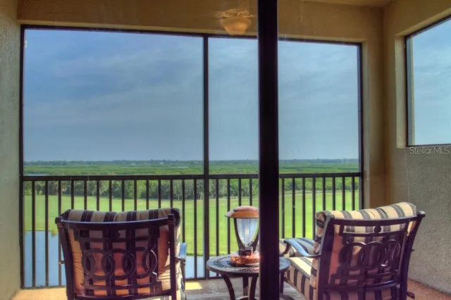 a view of a two chairs in the balcony