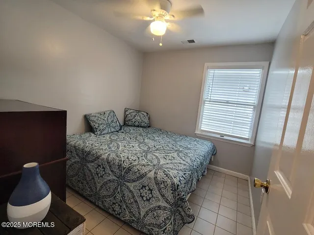 a bathroom with a sink toilet and a mirror