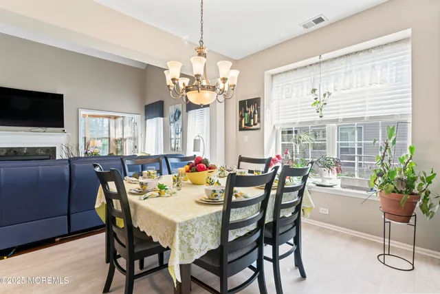 a view of a dining room with furniture window and outside view