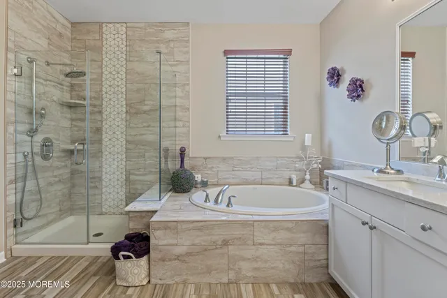 a bath room with a sink and a bath tub