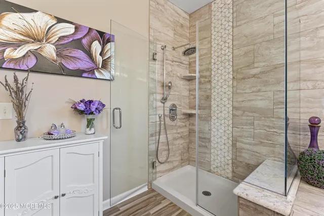 a bathroom with a bathtub and shower