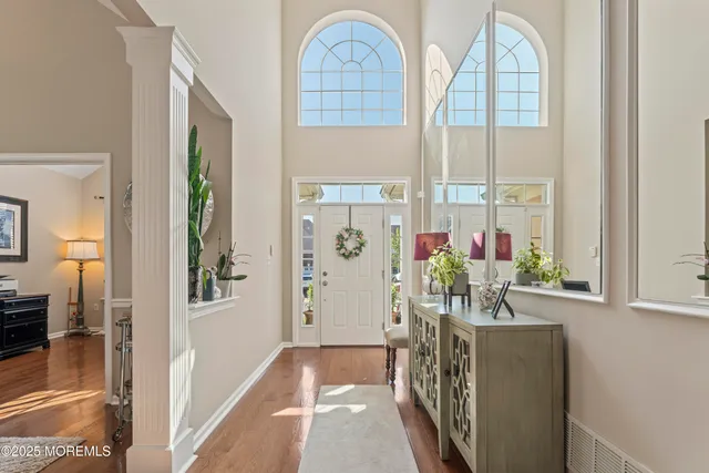 a view of hall way with furniture