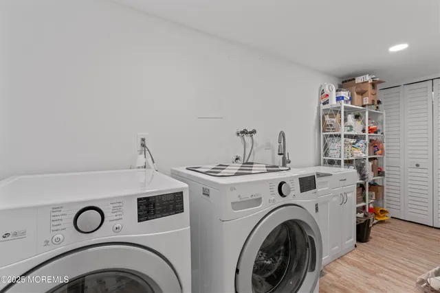a view of livingroom with washer and dryer