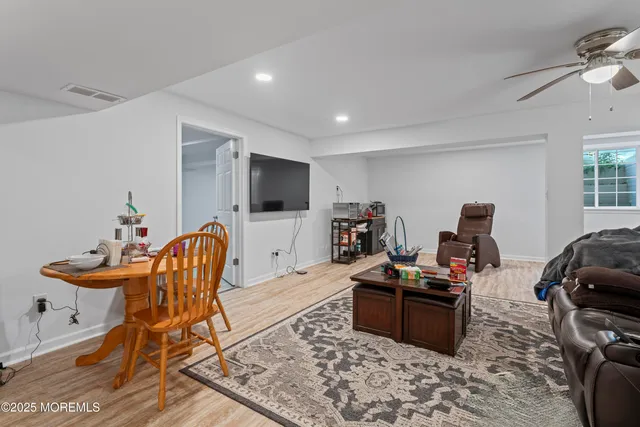 a workspace with furniture and a flat screen tv