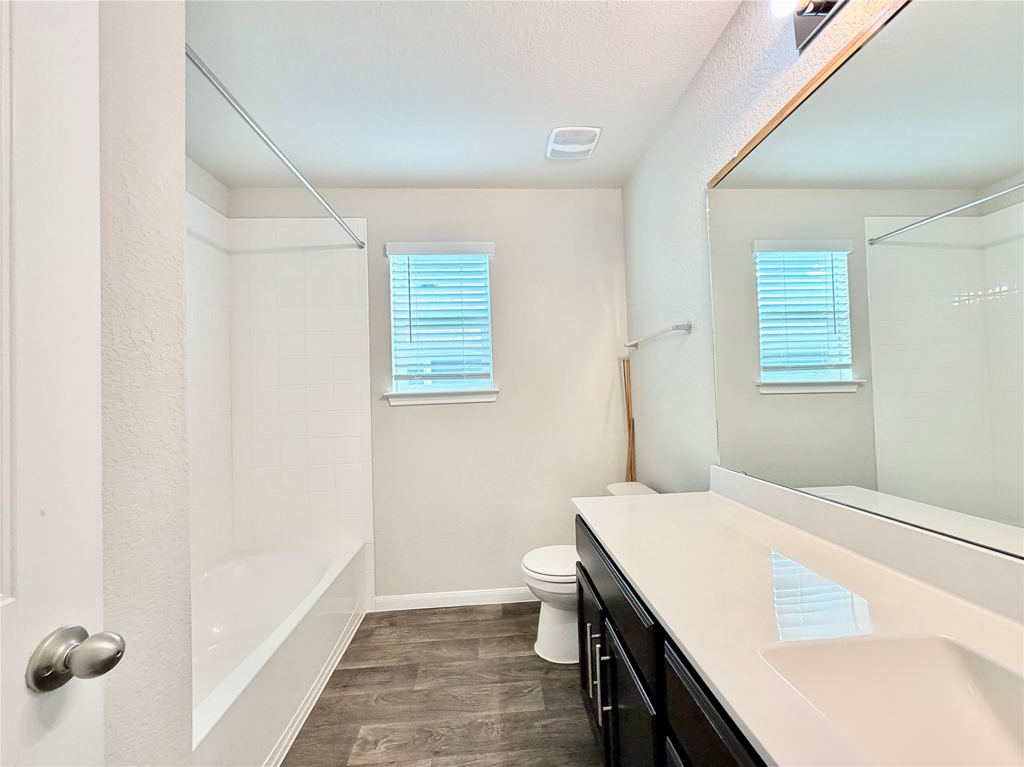 10502 Fulton Avenue Austin, TX 78754 - Photo 30 of 36 A well-appointed bathroom features a single vanity, bath, and shower, ensuring a comfortable experience.
