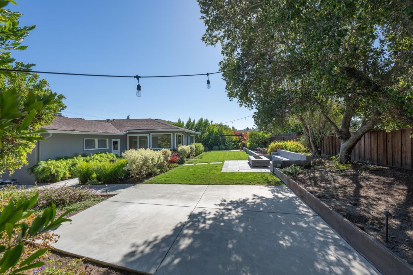 1208 Alomar Way Belmont, CA 94002 - Photo 14 of 18 a view of a front of house with a yard and potted plants