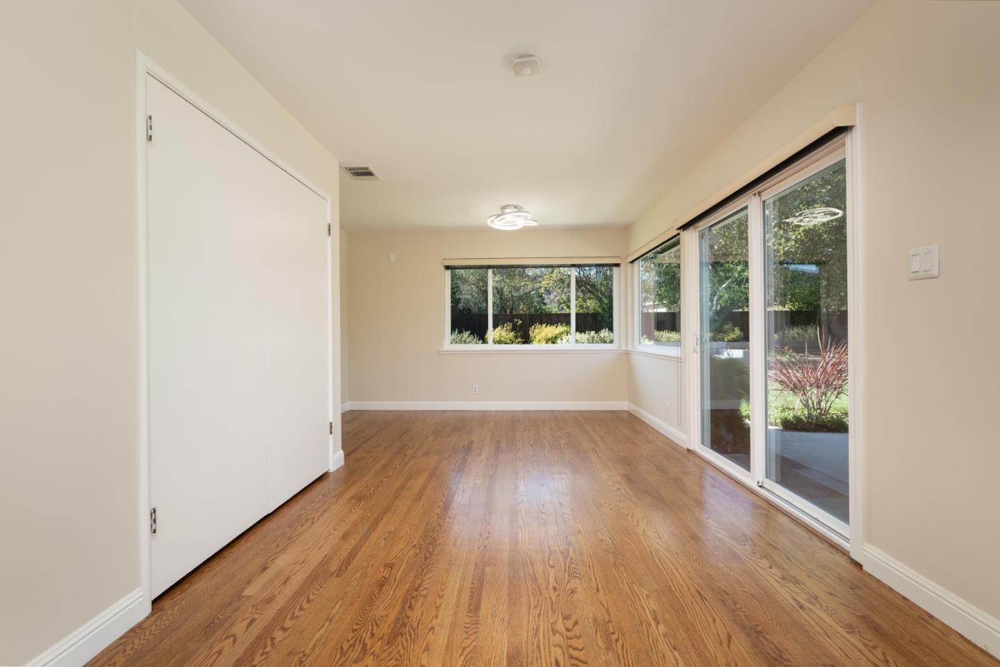 1208 Alomar Way Belmont, CA 94002 - Photo 5 of 18 wooden floor in an empty room with a window