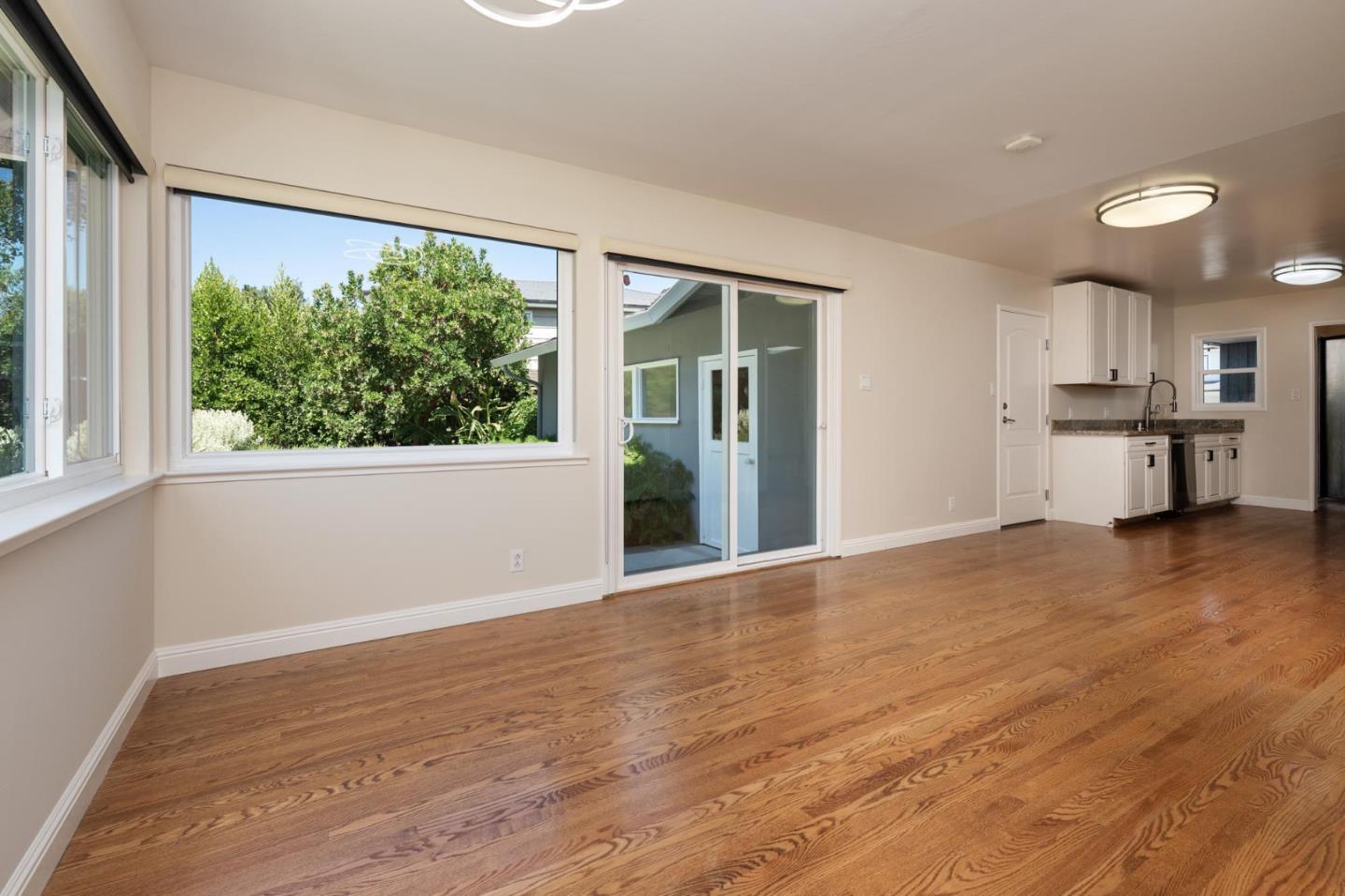 1208 Alomar Way Belmont, CA 94002 - Photo 6 of 18 a view of a kitchen with a sink and a large window