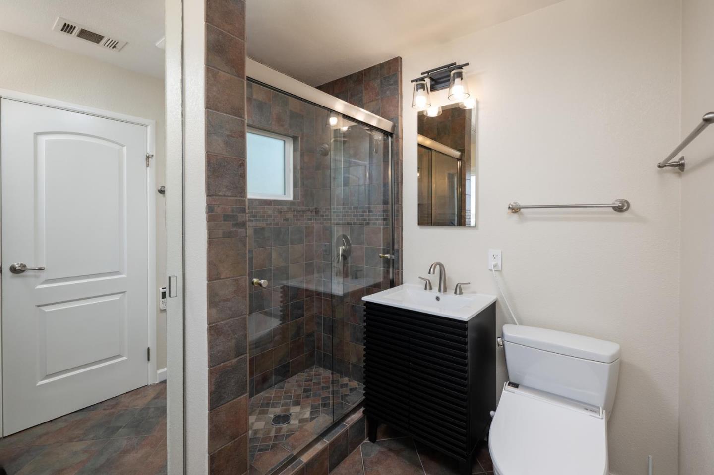 1208 Alomar Way Belmont, CA 94002 - Photo 9 of 18 a bathroom with a sink toilet and shower