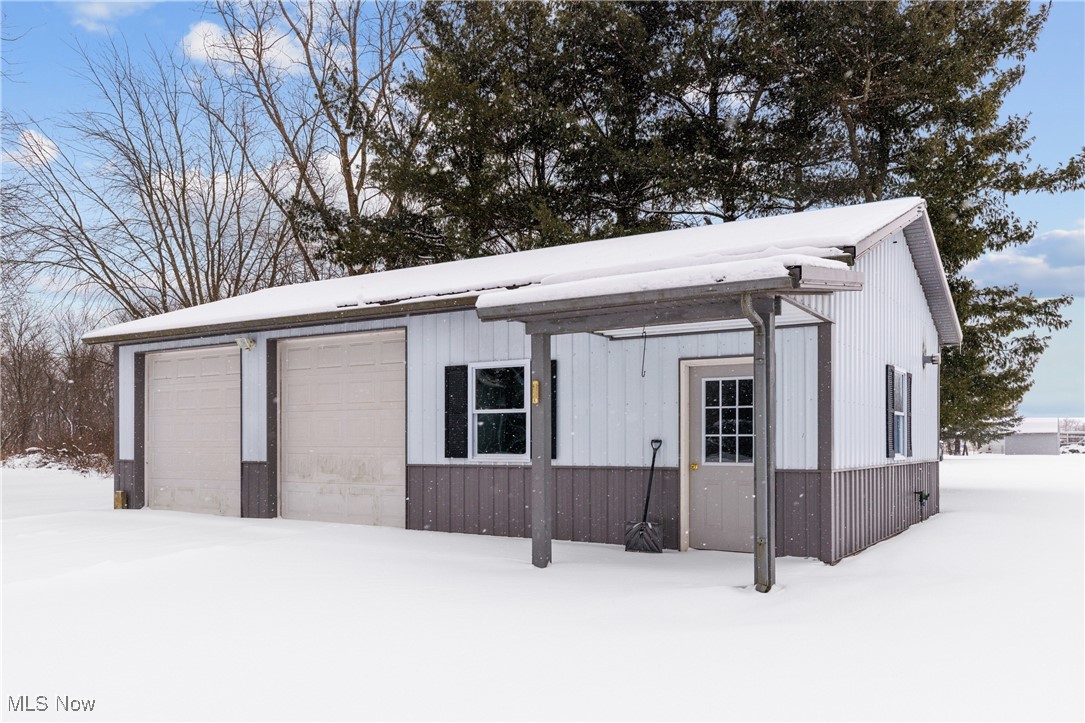 14816 Denman Road Wakeman, OH 44889 - Photo 33 of 41 Snow covered garage with a detached garage