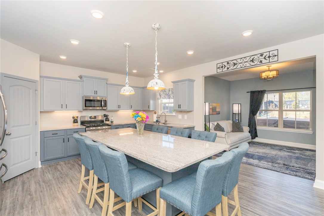 203 Graceview West Anderson, SC 29625 - Photo 9 of 50 This spacious kitchen, flowing into the living area, features an expansive island and contemporary finishes.