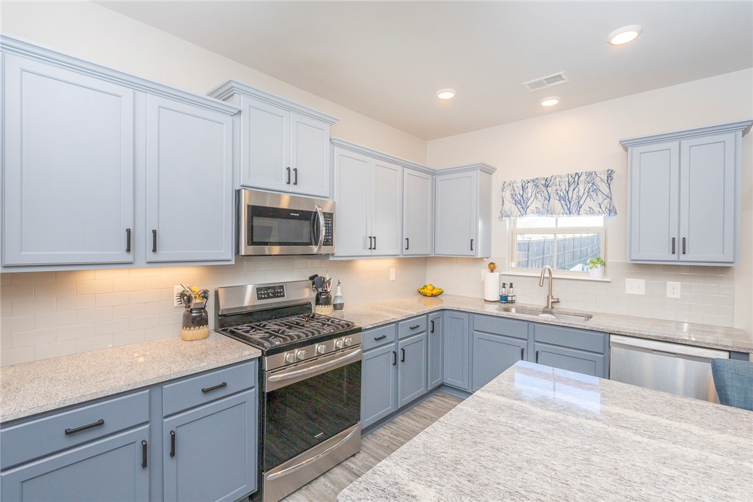 203 Graceview West Anderson, SC 29625 - Photo 10 of 50 This contemporary kitchen features ample counter space and modern appliances, perfect for any culinary enthusiast.