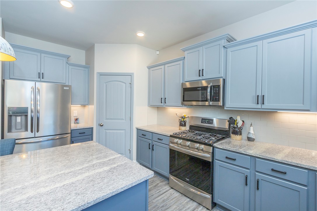 203 Graceview West Anderson, SC 29625 - Photo 11 of 50 This thoughtfully designed kitchen boasts ample counter space and sleek, modern finishes.