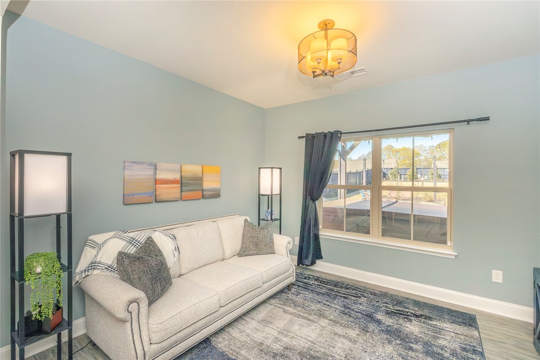 203 Graceview West Anderson, SC 29625 - Photo 14 of 50 This living area features ample natural light and elegant hardwood floors.
