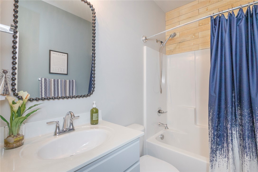 203 Graceview West Anderson, SC 29625 - Photo 18 of 50 This bathroom features a contemporary vanity and a classic shower-tub combination.