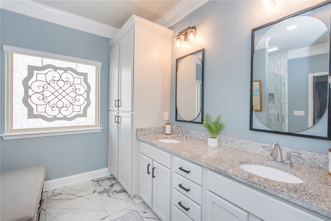 203 Graceview West Anderson, SC 29625 - Photo 26 of 50 This spacious bathroom features a double vanity and luxurious marble flooring, perfect for daily routines.