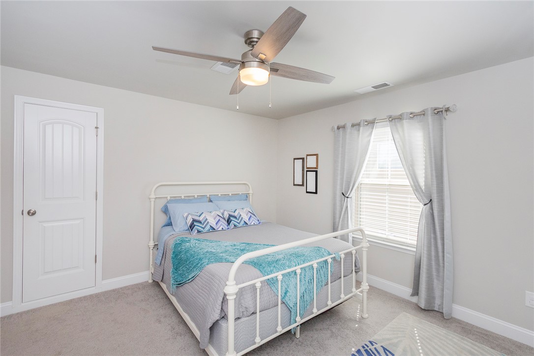 203 Graceview West Anderson, SC 29625 - Photo 29 of 50 This bright bedroom features a ceiling fan, plush carpeting, and natural light.