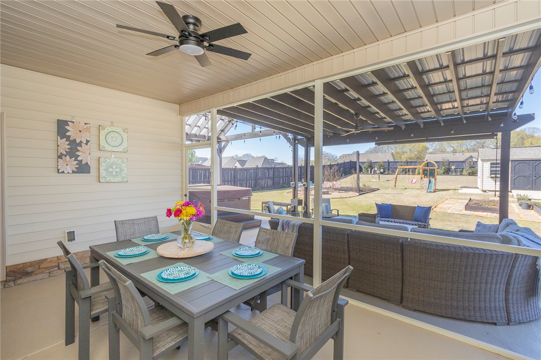 203 Graceview West Anderson, SC 29625 - Photo 31 of 50 This inviting covered patio offers a comfortable space for outdoor living and entertaining.