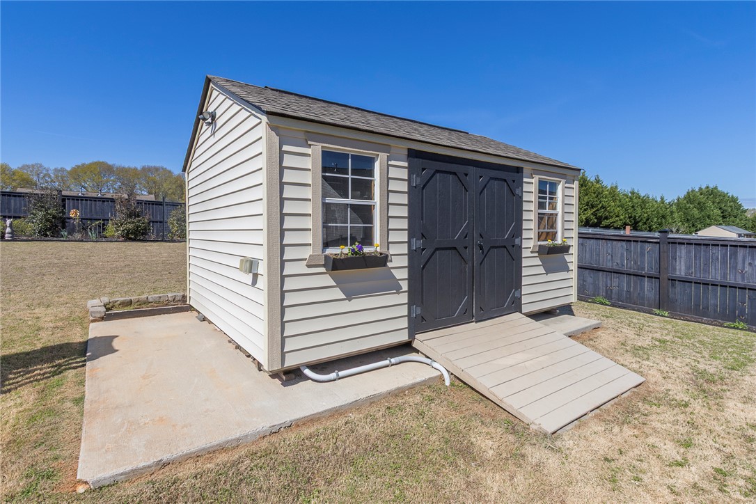 203 Graceview West Anderson, SC 29625 - Photo 43 of 50 This charming utility shed offers practical storage solutions for any outdoor space.