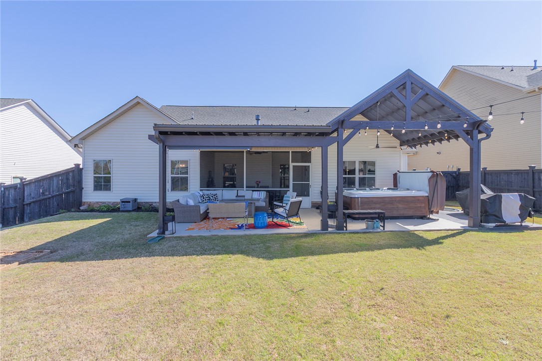 203 Graceview West Anderson, SC 29625 - Photo 44 of 50 This spacious backyard oasis features a screened patio, perfect for relaxation and entertainment.