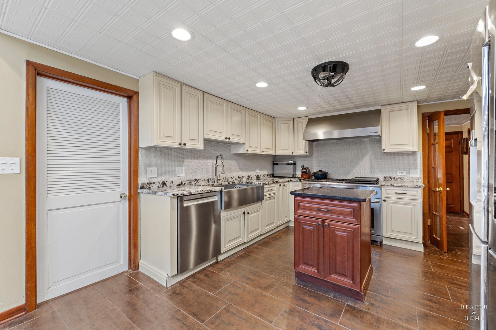 99 Lee Road Northbrook, IL 60062 - Photo 19 of 57 a kitchen with stainless steel appliances granite countertop a stove and a refrigerator