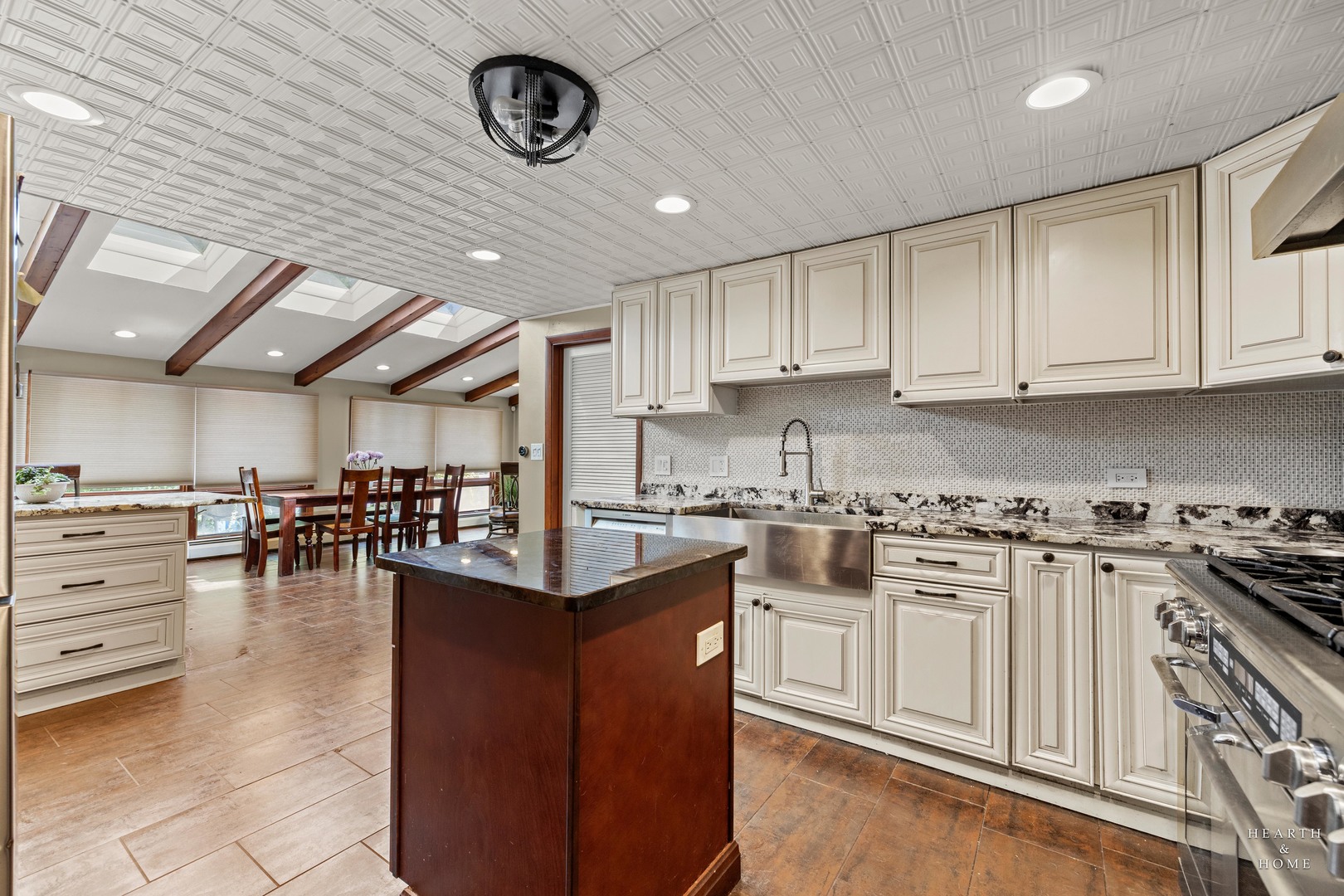 99 Lee Road Northbrook, IL 60062 - Photo 21 of 57 a kitchen with stainless steel appliances granite countertop a stove a sink dishwasher and a refrigerator with wooden cabinets
