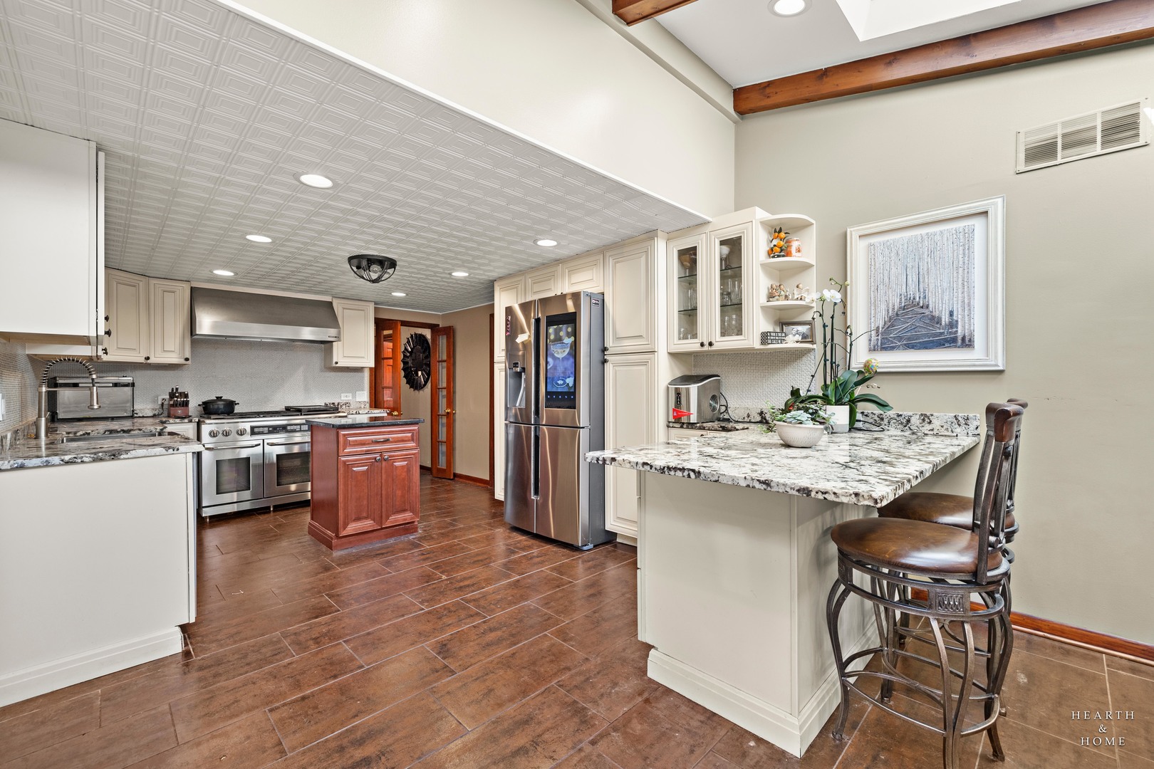 99 Lee Road Northbrook, IL 60062 - Photo 23 of 57 a kitchen with stainless steel appliances kitchen island granite countertop a sink and cabinets
