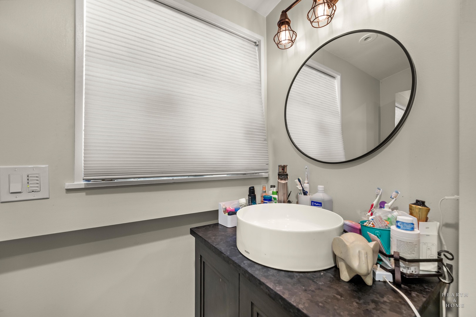 99 Lee Road Northbrook, IL 60062 - Photo 31 of 57 a bathroom with a sink and a mirror