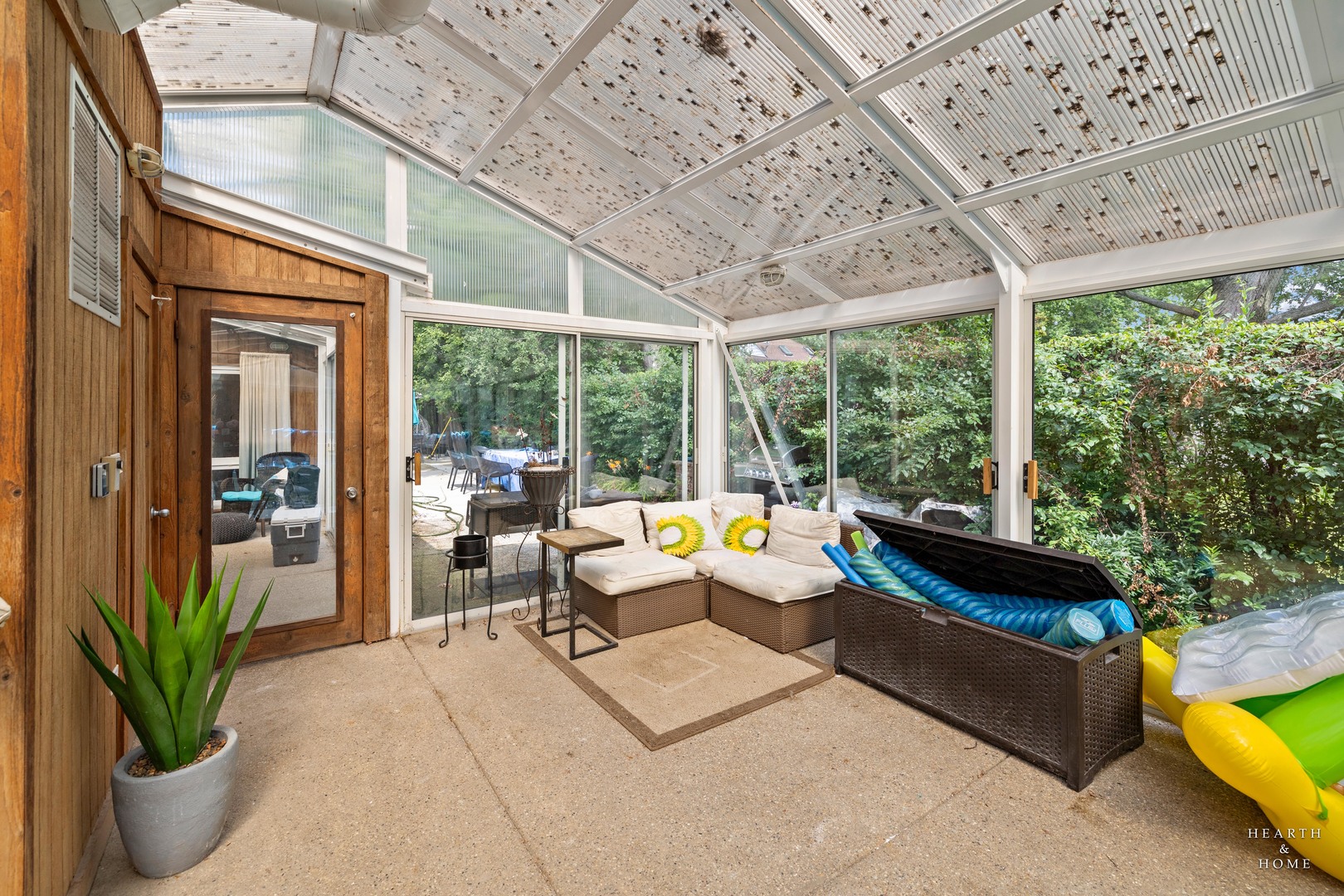 99 Lee Road Northbrook, IL 60062 - Photo 43 of 57 a living room with patio furniture and floor to ceiling windows