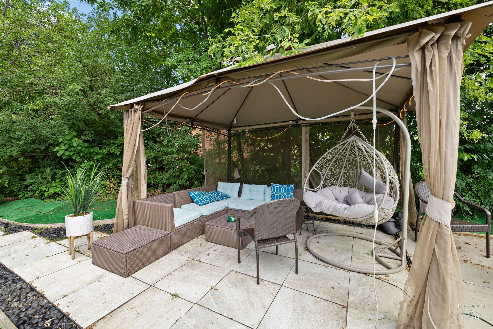 99 Lee Road Northbrook, IL 60062 - Photo 45 of 57 a view of patio with table and chairs under an umbrella