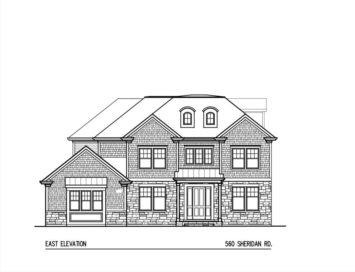 a view of a brick house with large windows