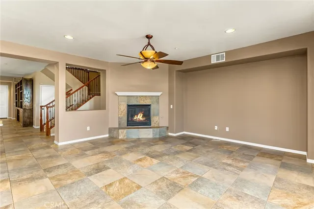 a kitchen with stainless steel appliances granite countertop wooden cabinets a granite counter tops and a large window