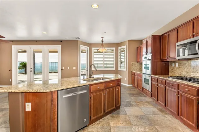 a view of a room with a ceiling fan and window