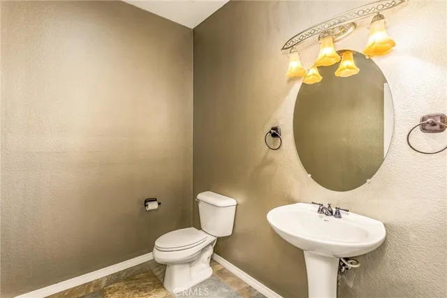 an empty room with sliding door and balcony view