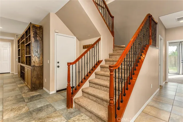 a bathroom with a granite countertop sink toilet a large mirror and shower