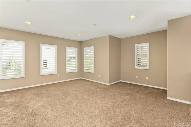 a bathroom with a double vanity sink toilet and shower