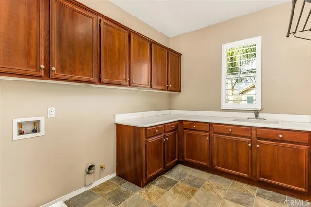a view of an empty room with a ceiling fan