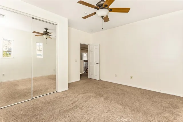 a spacious bathroom with a tub sink double vanity granite and a mirror