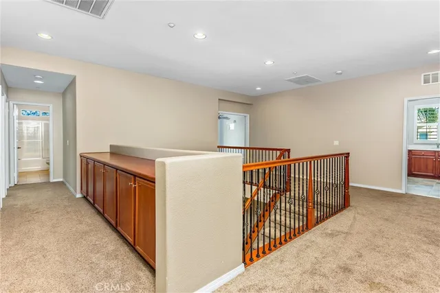 a view of a swimming pool with outdoor seating