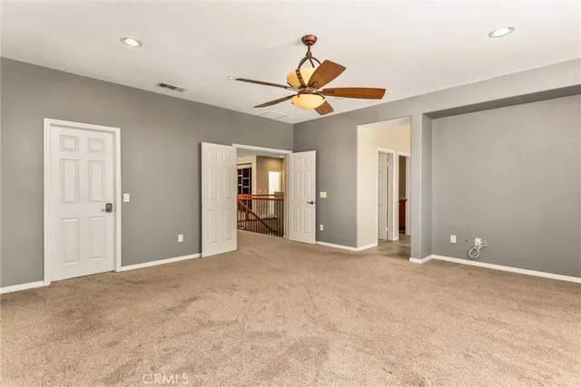 a view of a patio with a table and chairs