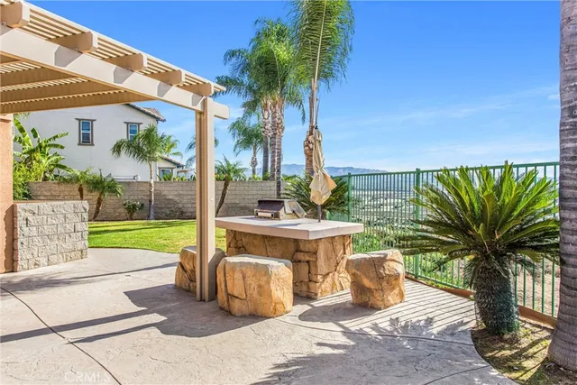 an aerial view of a house with a yard and potted plants
