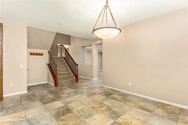 a view of an empty room with a fireplace