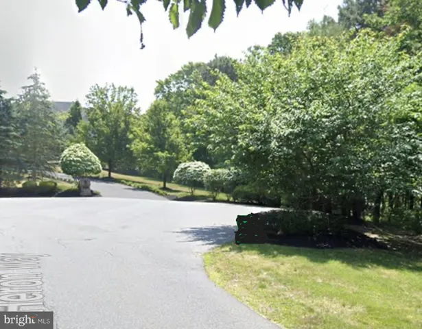 a swimming pool with some trees in the background