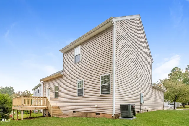 a view of house with yard