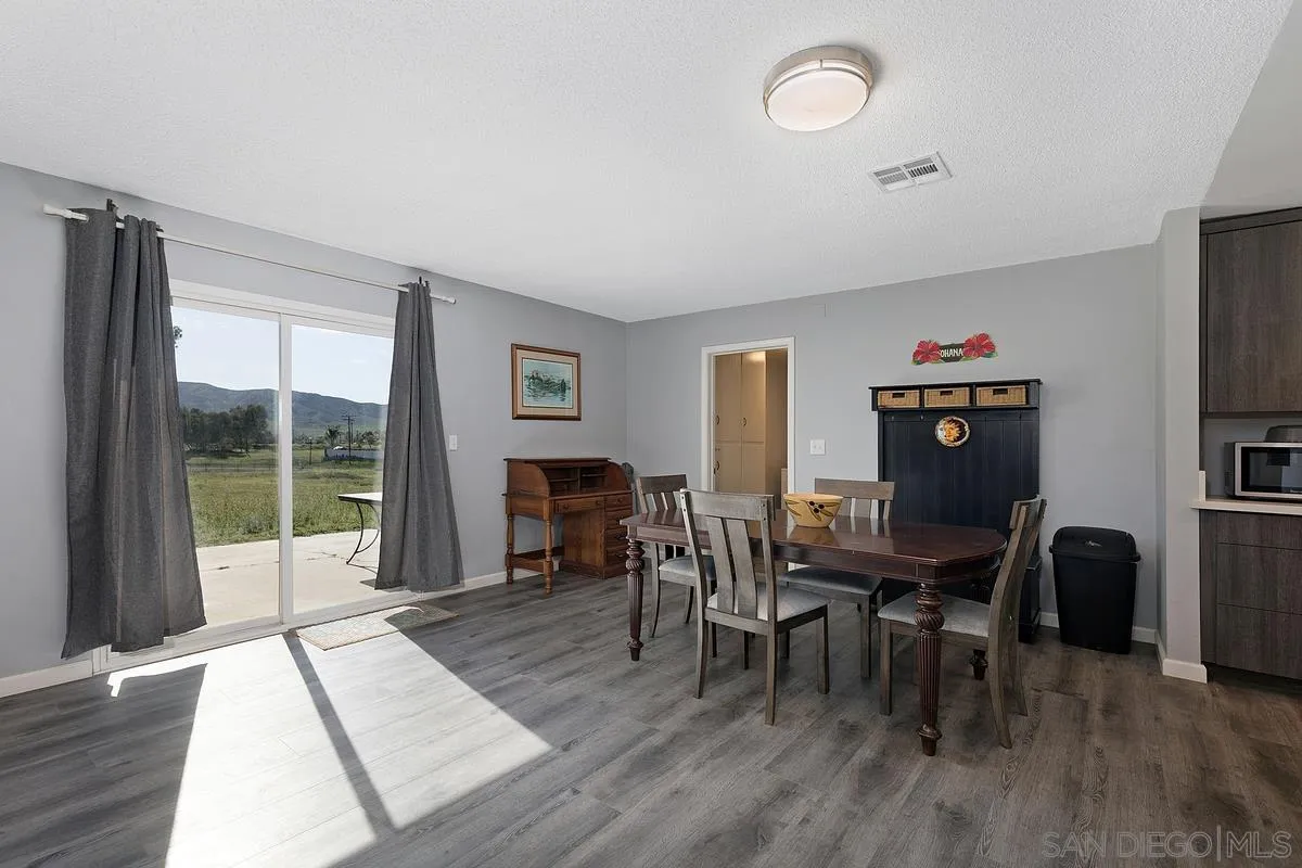 24567 Adams Avenue Murrieta, CA 92562 - Photo 11 of 42 a view of a livingroom with furniture window and wooden floor