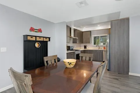 a dining room with furniture and window