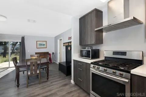 a kitchen with a stove and a refrigerator