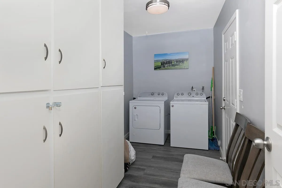 24567 Adams Avenue Murrieta, CA 92562 - Photo 18 of 42 a view of a hallway with washer and dryer