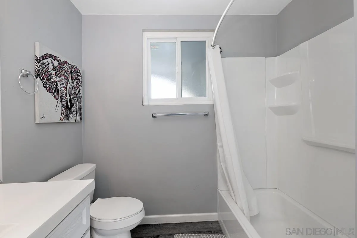 24567 Adams Avenue Murrieta, CA 92562 - Photo 19 of 42 a white toilet sitting next to a bathroom sink