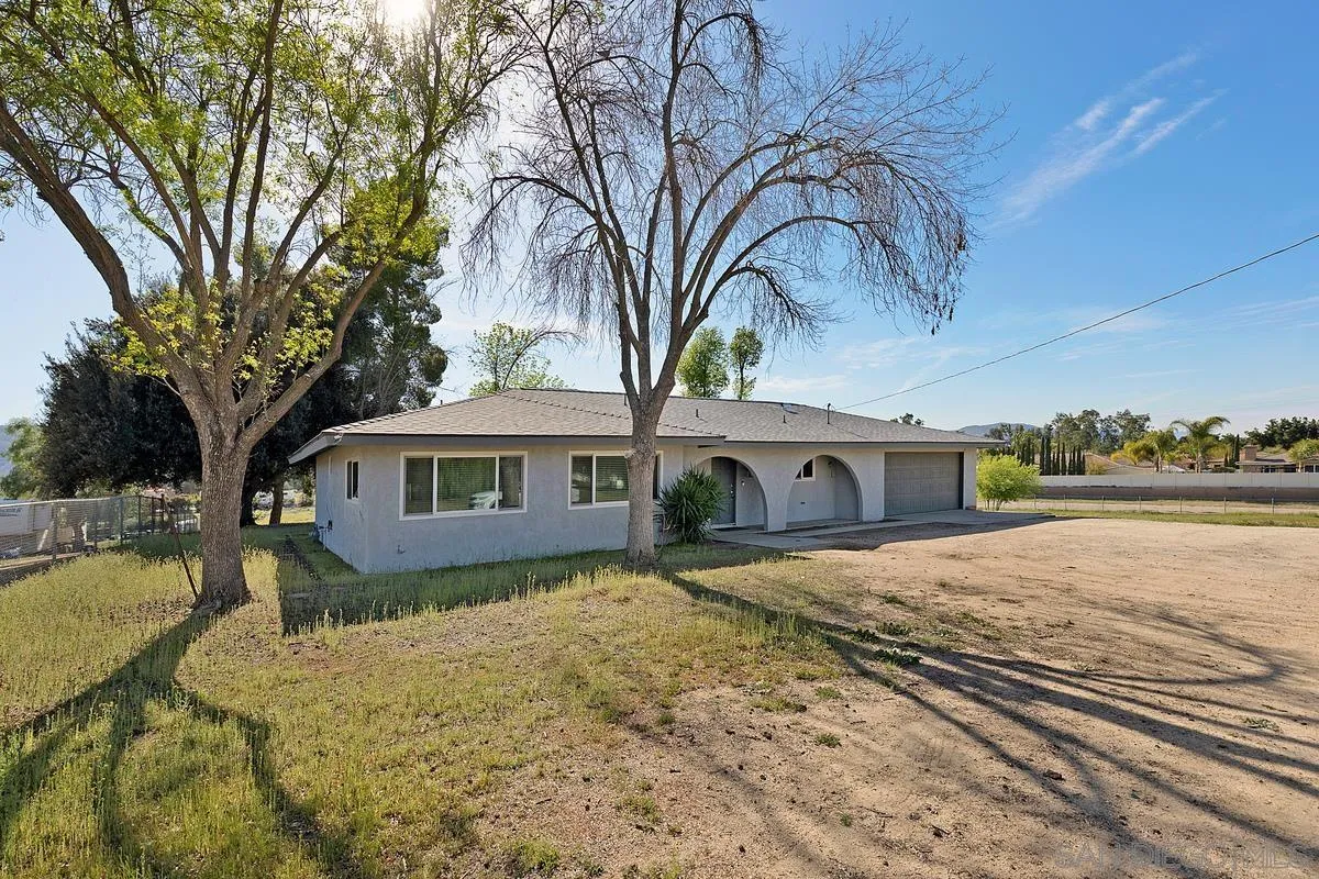24567 Adams Avenue Murrieta, CA 92562 - Photo 2 of 42 a view of a house with snow on the roof